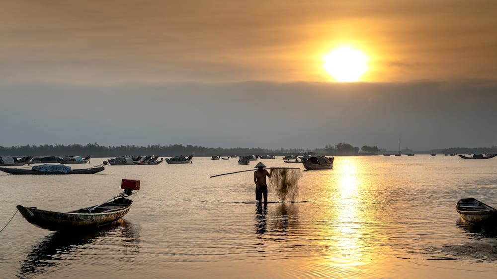 Dawn over Quang Loi Lagoon. Quang Loi commune, Quang Dien, Thua Thien - Hue, Vietnam belonging to the Tam Giang lagoon system, with an area 800 hectares