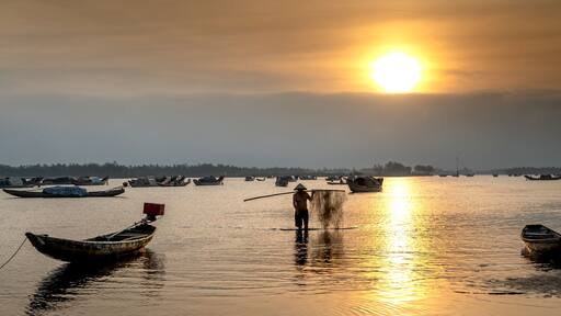 Dawn over Quang Loi Lagoon. Quang Loi commune, Quang Dien, Thua Thien - Hue, Vietnam belonging to the Tam Giang lagoon system, with an area 800 hectares