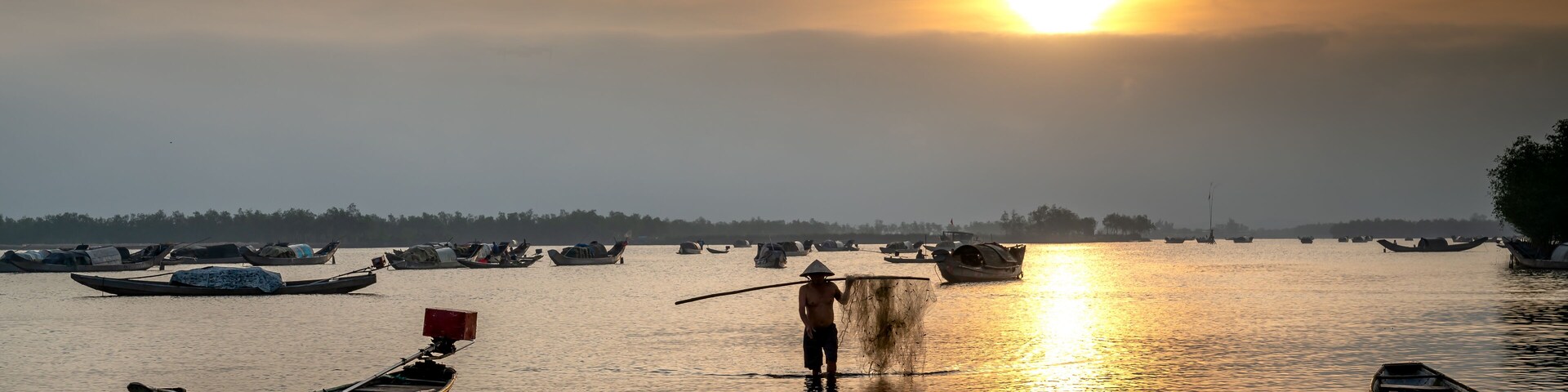 Dawn over Quang Loi Lagoon. Quang Loi commune, Quang Dien, Thua Thien - Hue, Vietnam belonging to the Tam Giang lagoon system, with an area 800 hectares