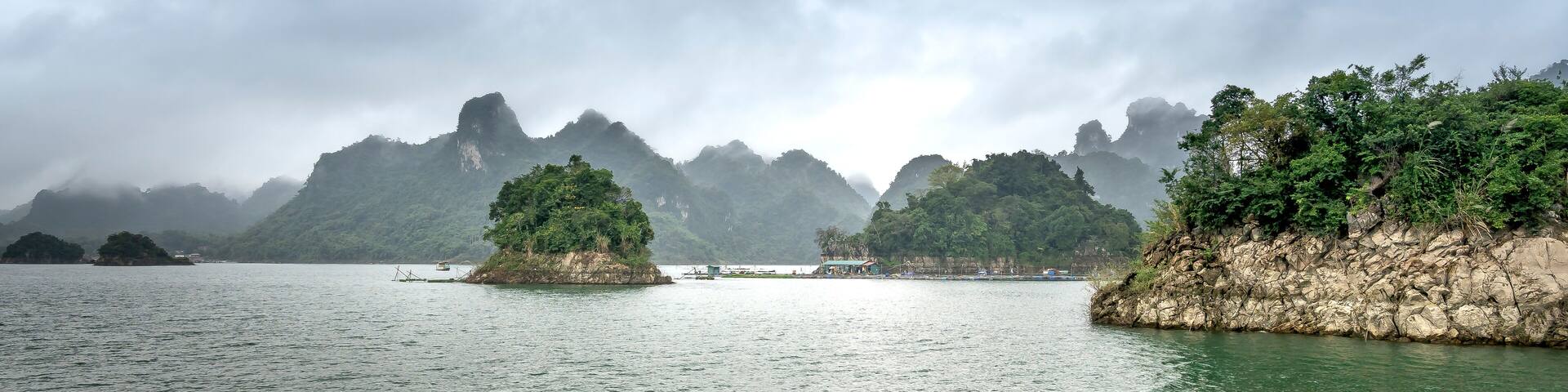 Na Hang lake in Tuyen Quang province, Viet Nam. This natural lake has a green watercolor. It is located between the majestic cliffs. Every year this place attracts many tourists to visit