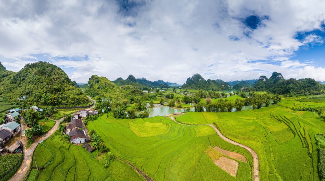 Aerial landscape in Quay Son river, Trung Khanh, Cao Bang, Vietnam with nature, green rice fields and rustic indigenous houses