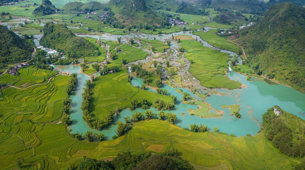 Aerial landscape in Quay Son river, Trung Khanh, Cao Bang, Vietnam with nature, green rice fields and rustic indigenous houses
