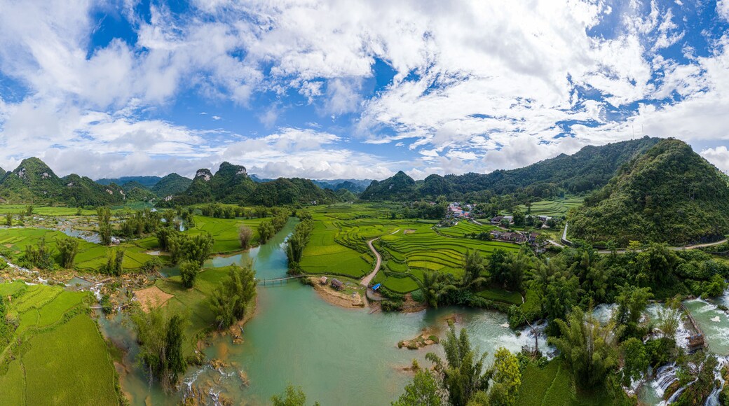 Aerial landscape in Quay Son river, Trung Khanh, Cao Bang, Vietnam with nature, green rice fields and rustic indigenous houses