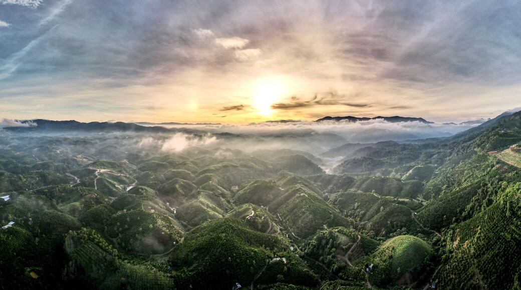 Fanciful scenery of an early morning when the sun rises over the Dai Lao mountain range, Bao Loc district, Lam Dong province, Vietnam