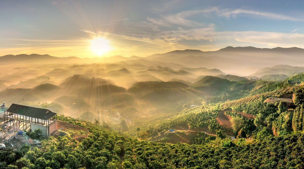 Fanciful scenery of an early morning when the sun rises over the Dai Lao mountain range, Bao Loc district, Lam Dong province, Vietnam