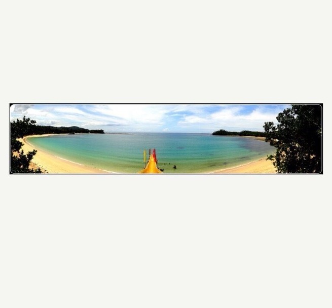 This beach is amazing. It is surrounded by coconut trees a slide straight to the beach, white sand and serene blue water. Worth visiting!