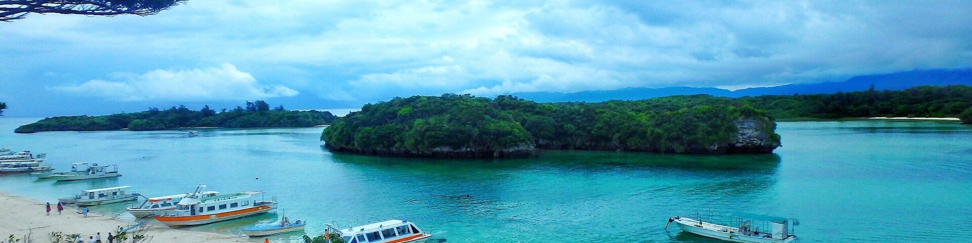 Kabira Bay 川平灣 is located on the north coast of Ishigaki Island, Okinawa Prefecture, Japan. Renowned for its white sands, turquoise waters and dense vegetation, the bay forms part of the Iriomote-Ishigaki National Park.