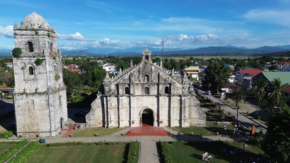 A historic church with a bell tower and a large entrance.