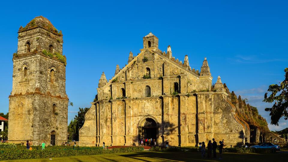 A historic church with a bell tower and intricate carvings.