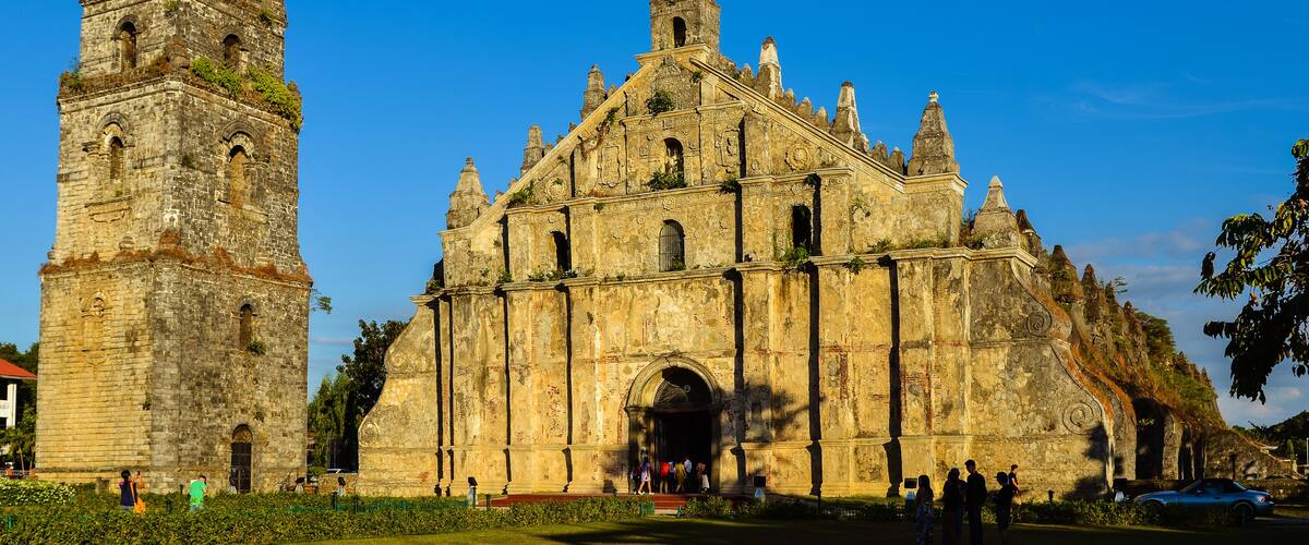 A historic church with a bell tower and intricate carvings.