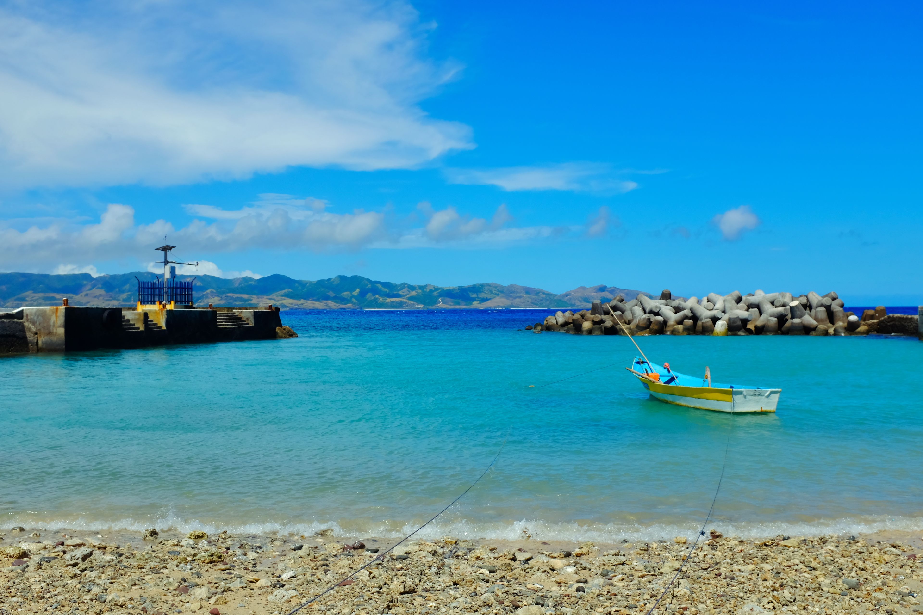 A small quiet and calm local seaport with blue sea and sky in Ivana Port,  Batanes, Philippines