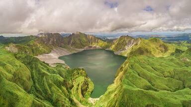 Aerial view of volcanic Lake Pinatubo and mountains, Porac, Philippines.