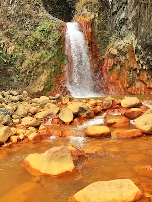 Pulangbato Falls. The rocks turn dark orange because of its sulfuric waters. amazing!!
