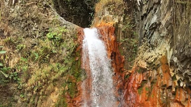 Pulangbato Falls. The rocks turn dark orange because of its sulfuric waters. amazing!!