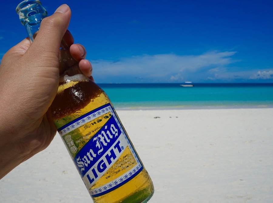 Chilling out along the white beach at the resort