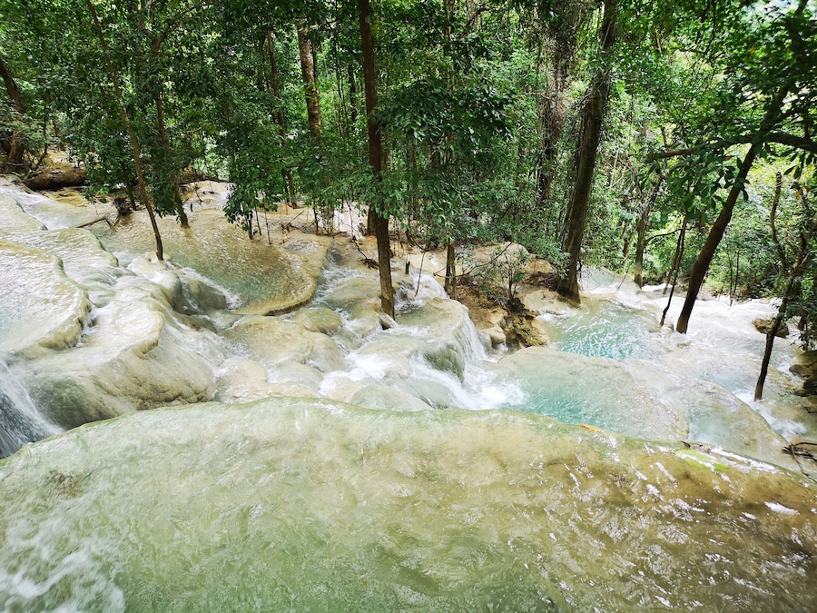 Kaparkan Water Falls
The Philippines 🇵🇭 is famous for its many rice terraces and so it was a pleasant surprise for me to learn about Kaparkan Water Falls which I personally describe as a beautiful cascading "water terraces"! The gods must have wanted this place for themselves that they made this gem of nature so remote and extremely difficult to get to. Unpaved roads make for a slow and super bumpy destination but the stunning views of green hills and mountains along the way sure makes up for it! The grass and trees are lush and bright green. This is also one of the very few places I have been to that is really clean! No trash or plastics along the way and on this very spot! 👍🏻
The trail is not accessible by ordinary vehicles. Only "monster trucks" are capable of getting adventurers through this "hell ride"! The truck ride by itself is an adventure and frankly, the highlight of the trip for me. A few minutes into the drive, after putting the chains on the wheels, I got unseated unceremoniously and earned myself a few bruises enough for me to give up filming so that I can use both my hands to hold on for dear life!
The water falls (terraces) are made up of varrying sized infinity pools with cool and clear water cascading from the topmost level and watersource all the way down to the river below. #LocalSecrets #ItsMoreFunInThePhilippines #Adventure #trovember #Outdoors