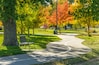 Autumn City Park - A sunny autumn afternoon view of a quiet running trail winding in a city park, Denver/Lakewood, Colorado, USA.