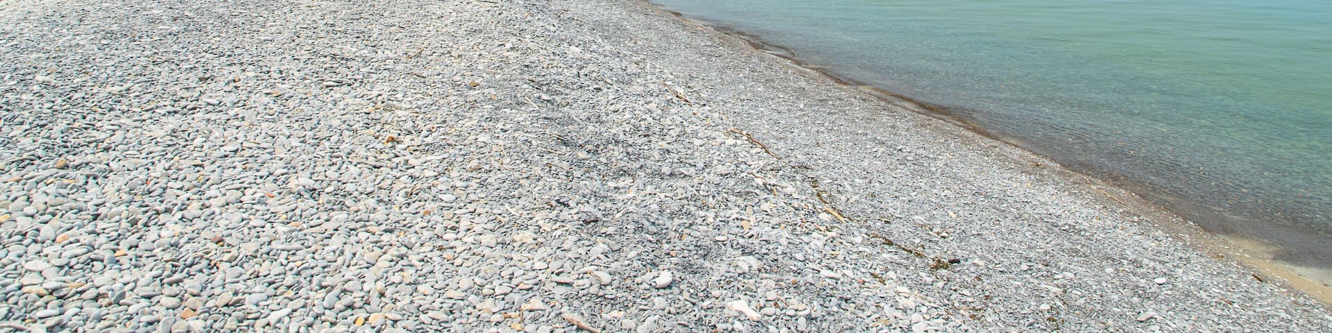 Prince Edward showing a pebble beach and general coastal views