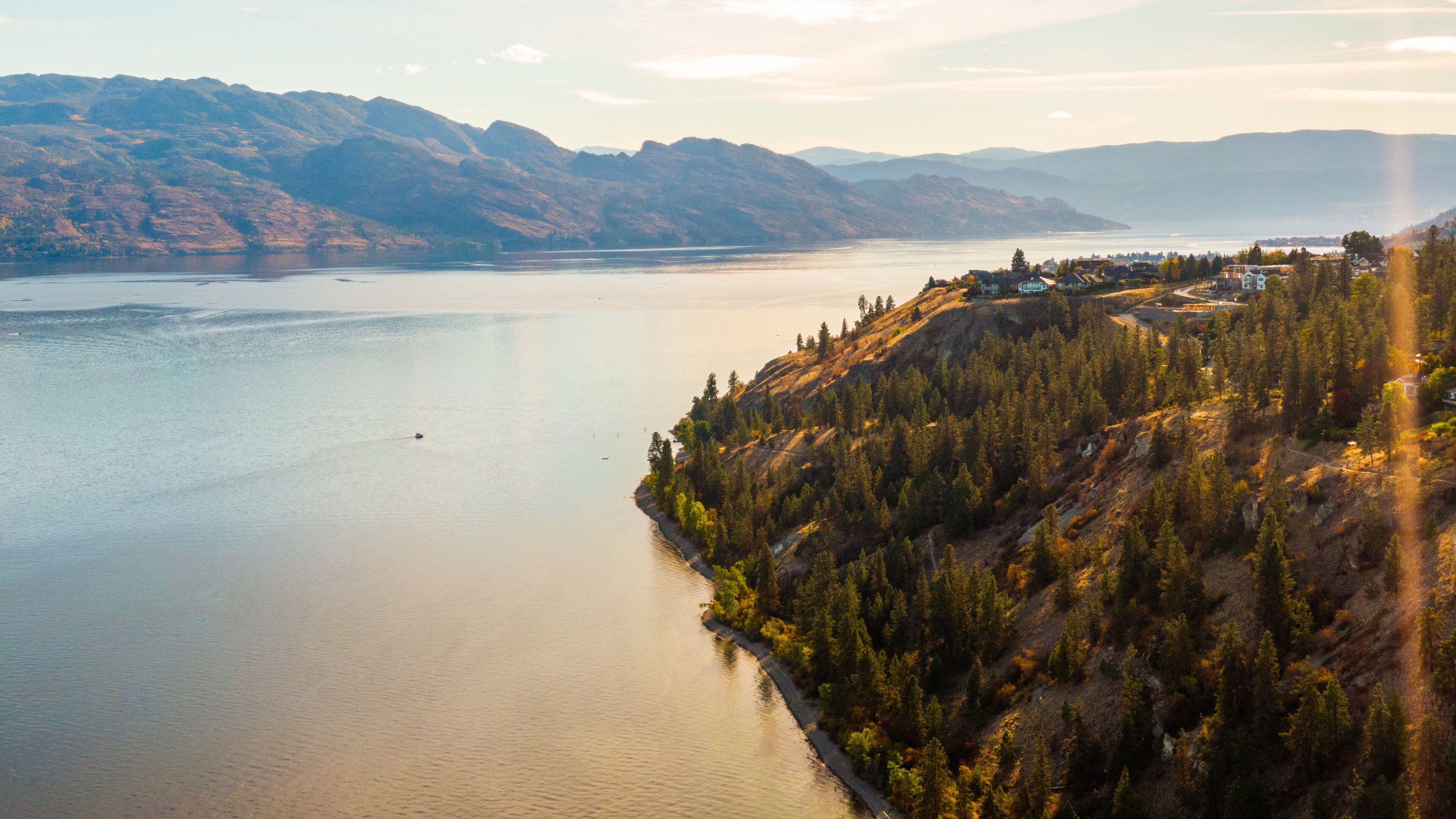 Okanagan Lake showing landscape views, a sunset and a lake or waterhole