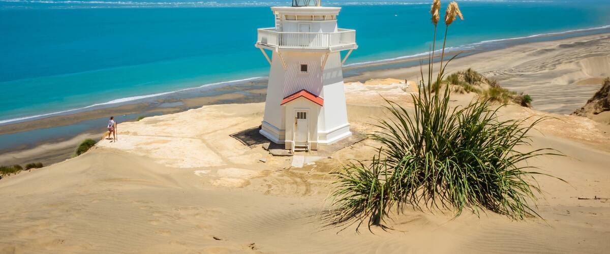 Pouto featuring a lighthouse, a sandy beach and general coastal views
