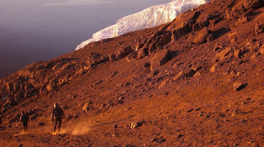 Descending while sun rises after reaching the top of Africa's highest peak, Mt. Kilimanjaro! (5895m)