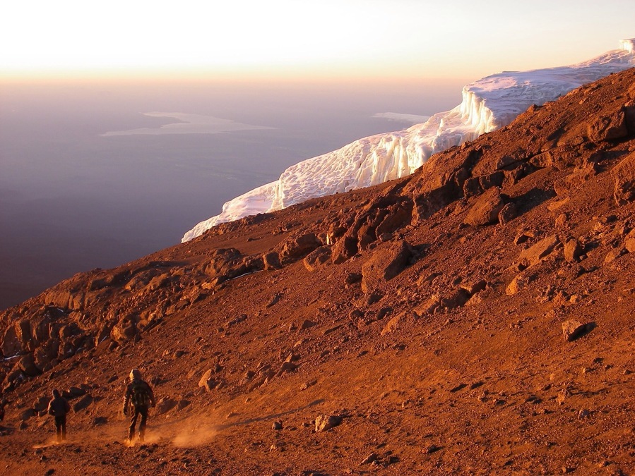 Descending while sun rises after reaching the top of Africa's highest peak, Mt. Kilimanjaro! (5895m)