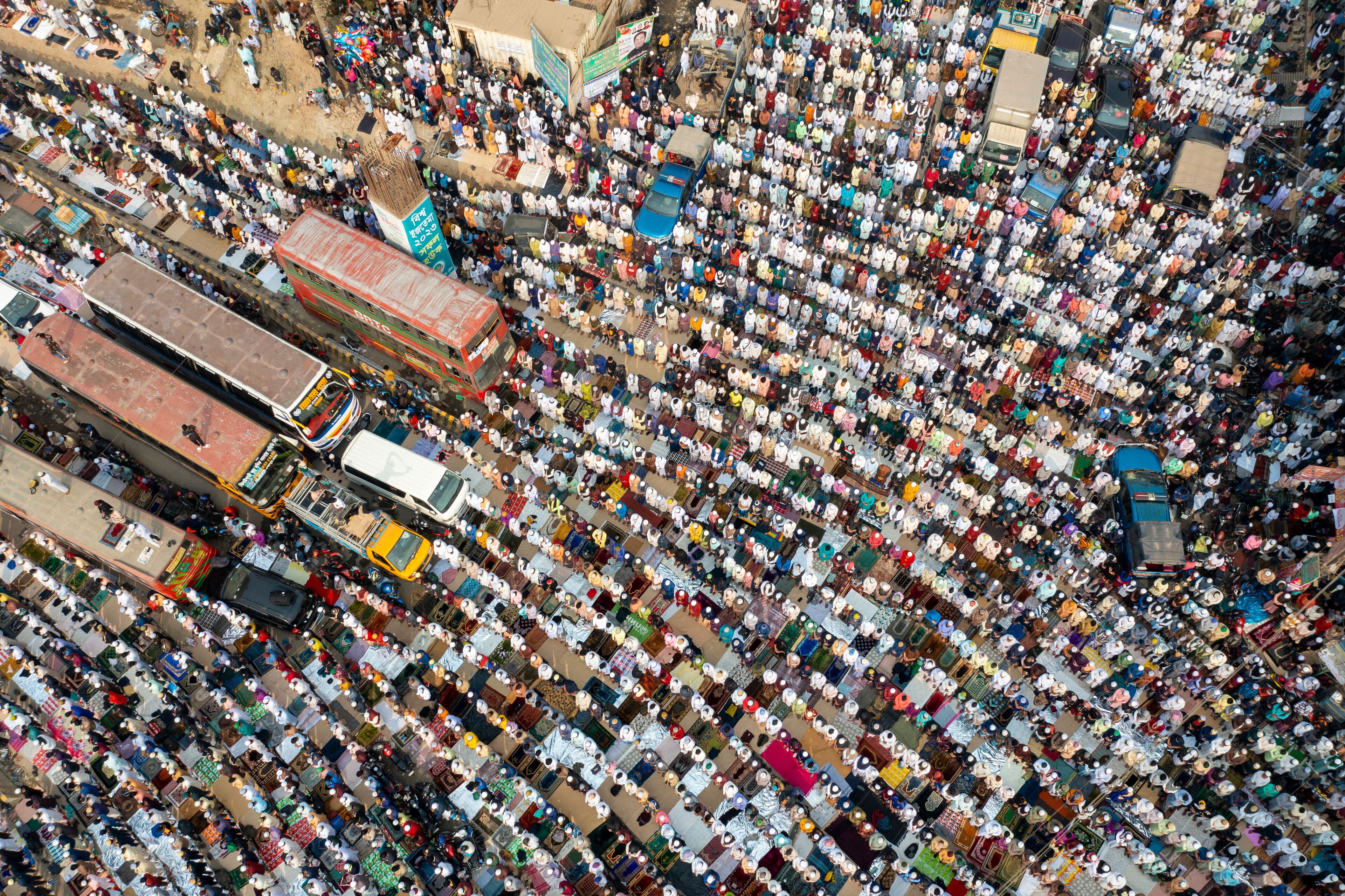 A densely packed market with numerous stalls and people.