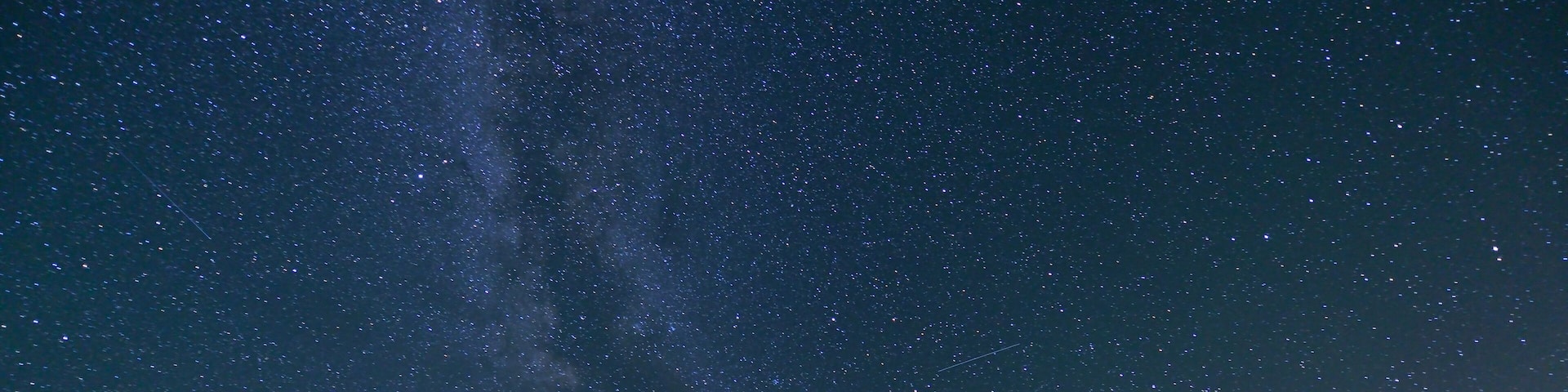 Milky Way and Mount Baker, red tent in foreground, taken at Artist Point in Mt. Baker-Snoqualmie National Forest.