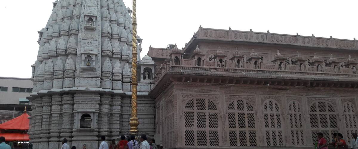 A temple with intricate carvings and a large spire.