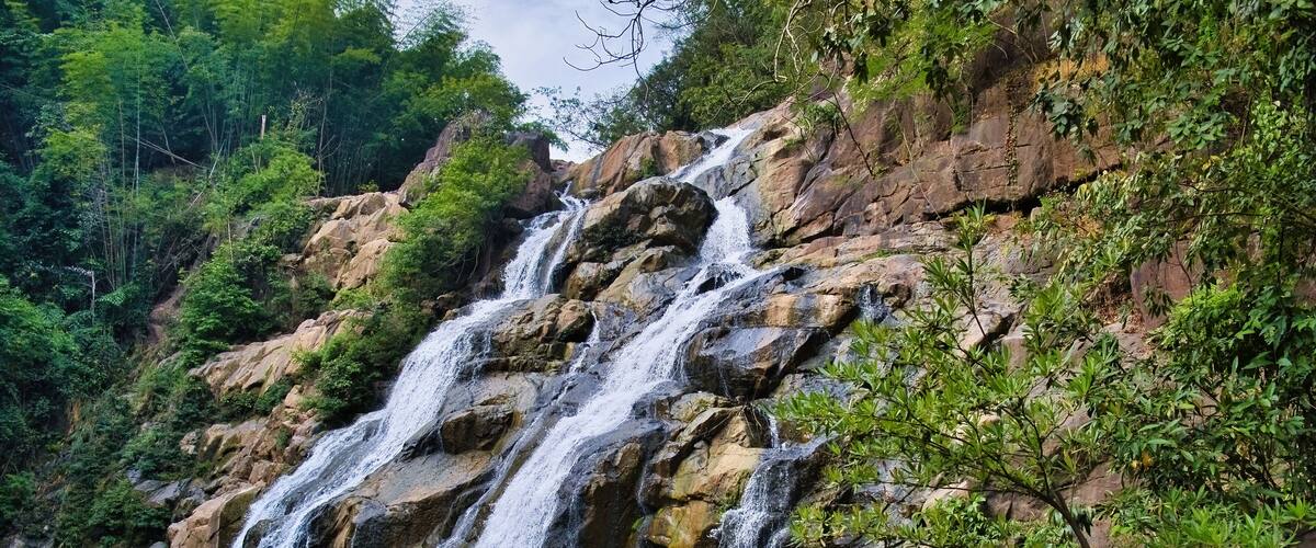 Namtok (waterfall) Than Thip in the rainforest of Than Thip Forest Park in the province of Phetchabun, Thailand, plunges into a deep pool
