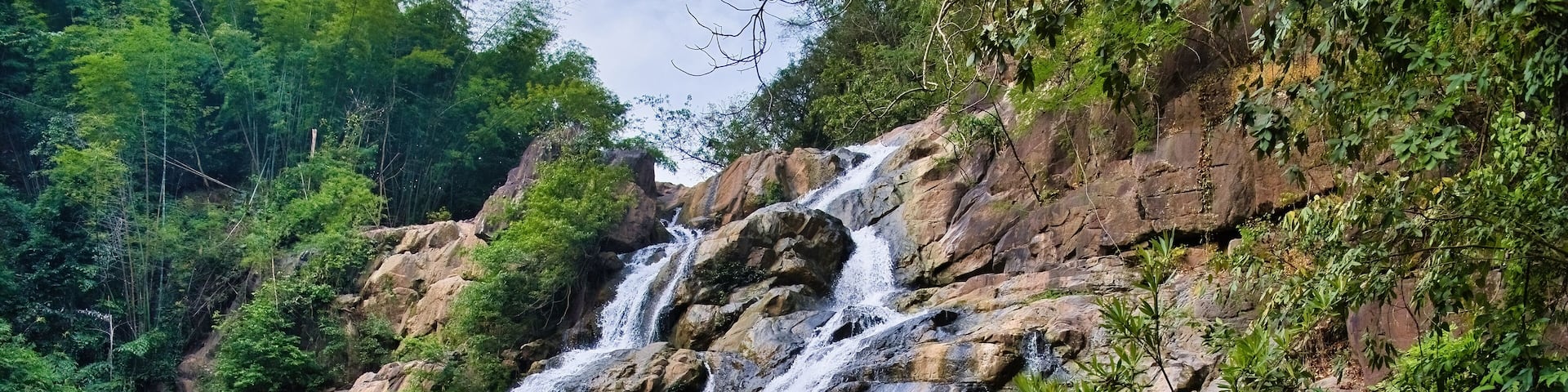 Namtok (waterfall) Than Thip in the rainforest of Than Thip Forest Park in the province of Phetchabun, Thailand, plunges into a deep pool