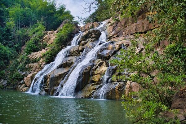 Namtok (waterfall) Than Thip in the rainforest of Than Thip Forest Park in the province of Phetchabun, Thailand, plunges into a deep pool