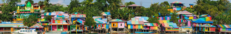 Raimbow village at Tual administrative town of Kei Kecil island, Moluccas, Indonesia. A colorful slum on the river bank called Kampung Pelangi. High resolution panorama.