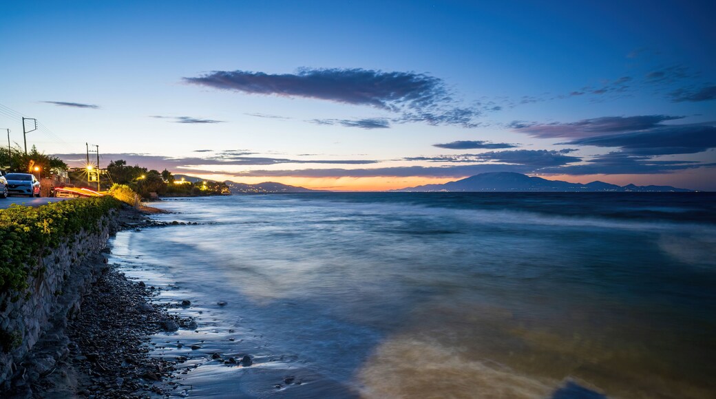 Long exposure shot of a coastal view of Mediterranean Sea during sunset next to car parks near drosia located in Zakynthos, Greece