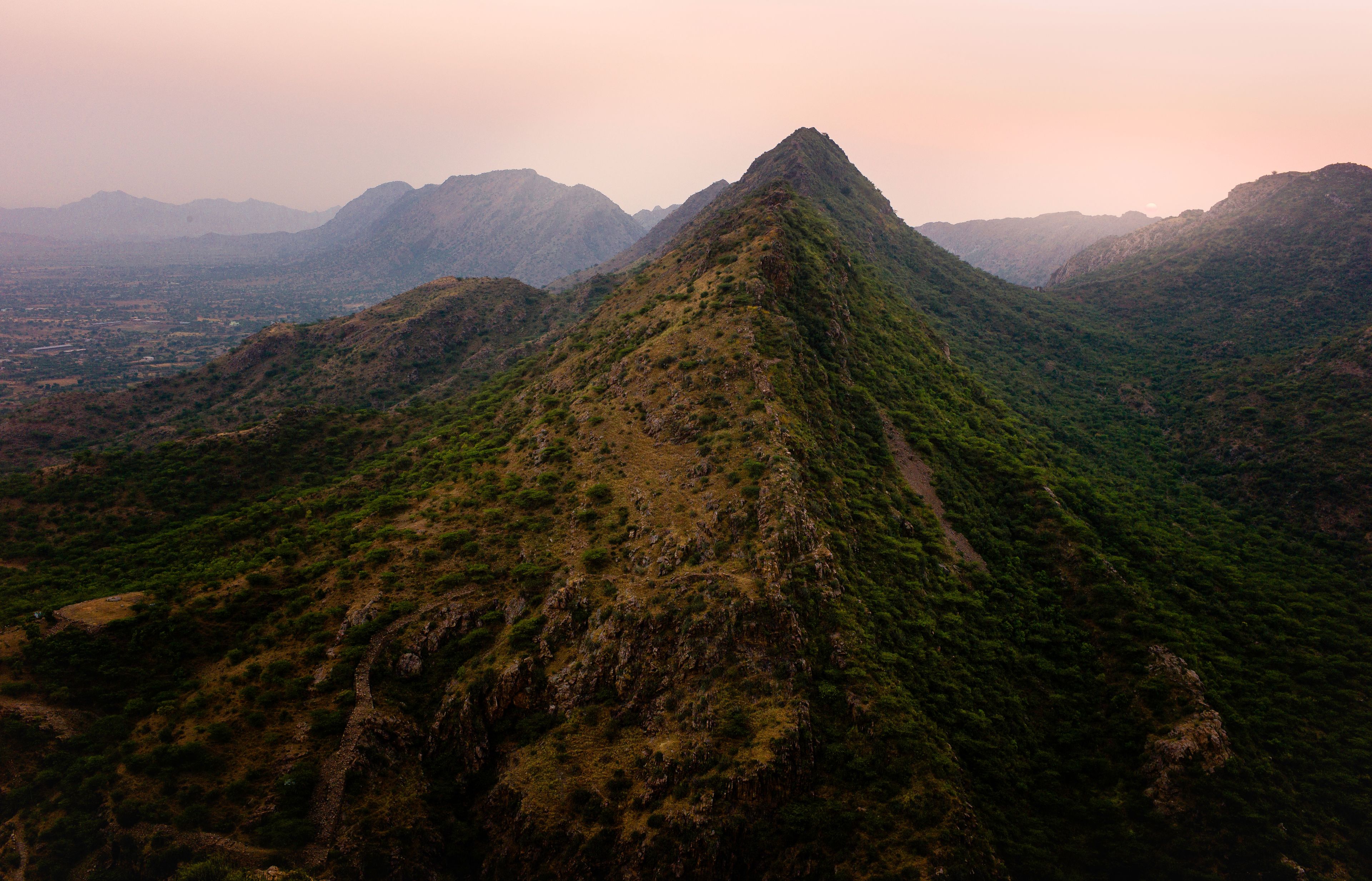 A mountain range with a prominent peak.