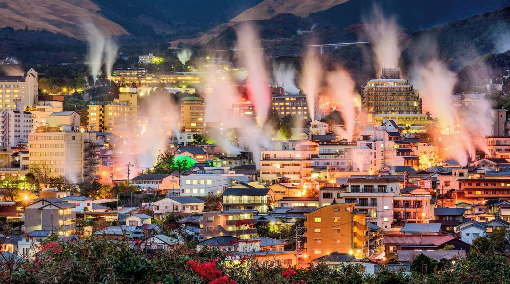 Beppu, Japan cityscape with hot spring bath houses with rising steam.