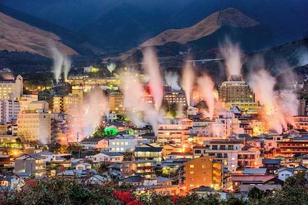 Beppu, Japan cityscape with hot spring bath houses with rising steam.
