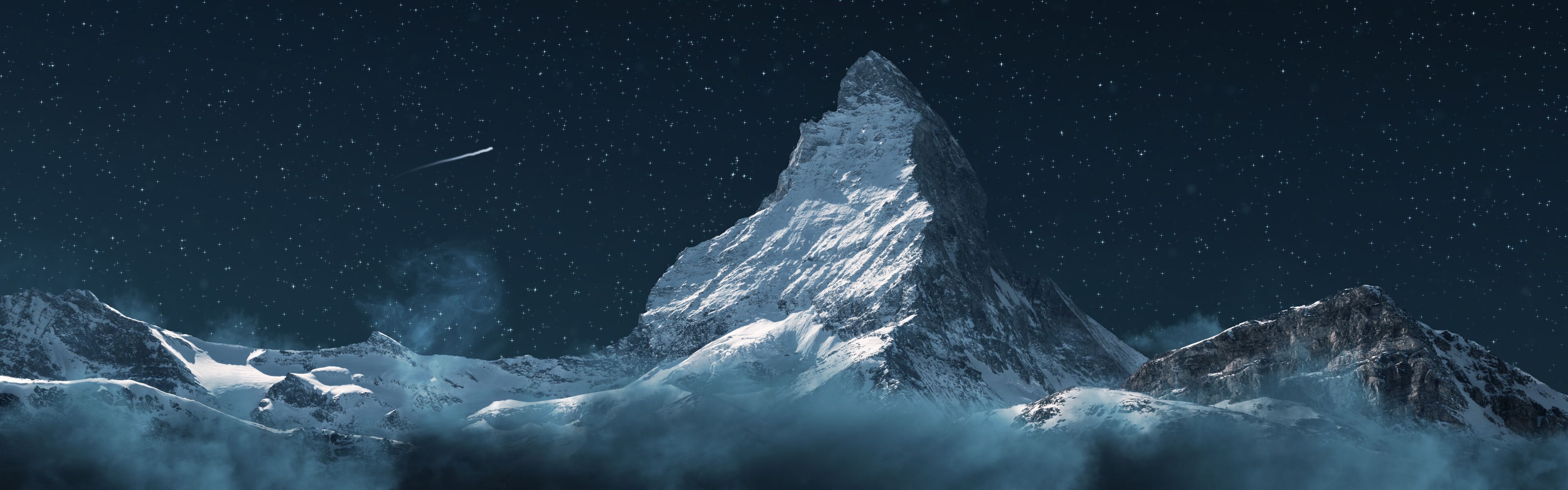 A snow-covered mountain peak under a starry night sky.