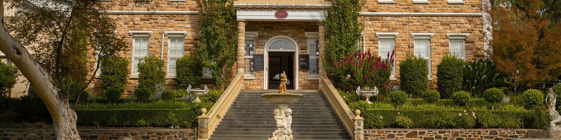 Chateau Yaldara featuring a fountain, a garden and heritage elements