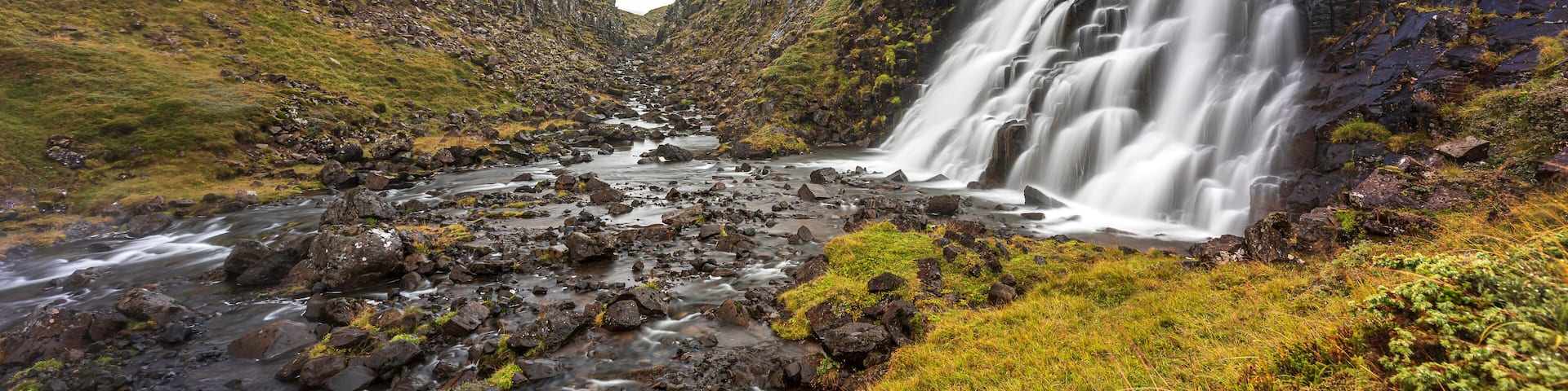Waterfall cascading into river, Eyja- og Miklaholtshreppur, Vesturland, Iceland