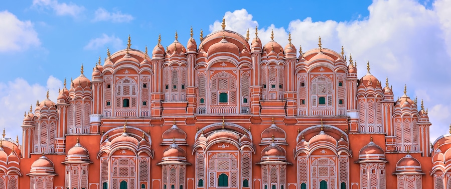 A large, ornate building with multiple domes and intricate architectural details.