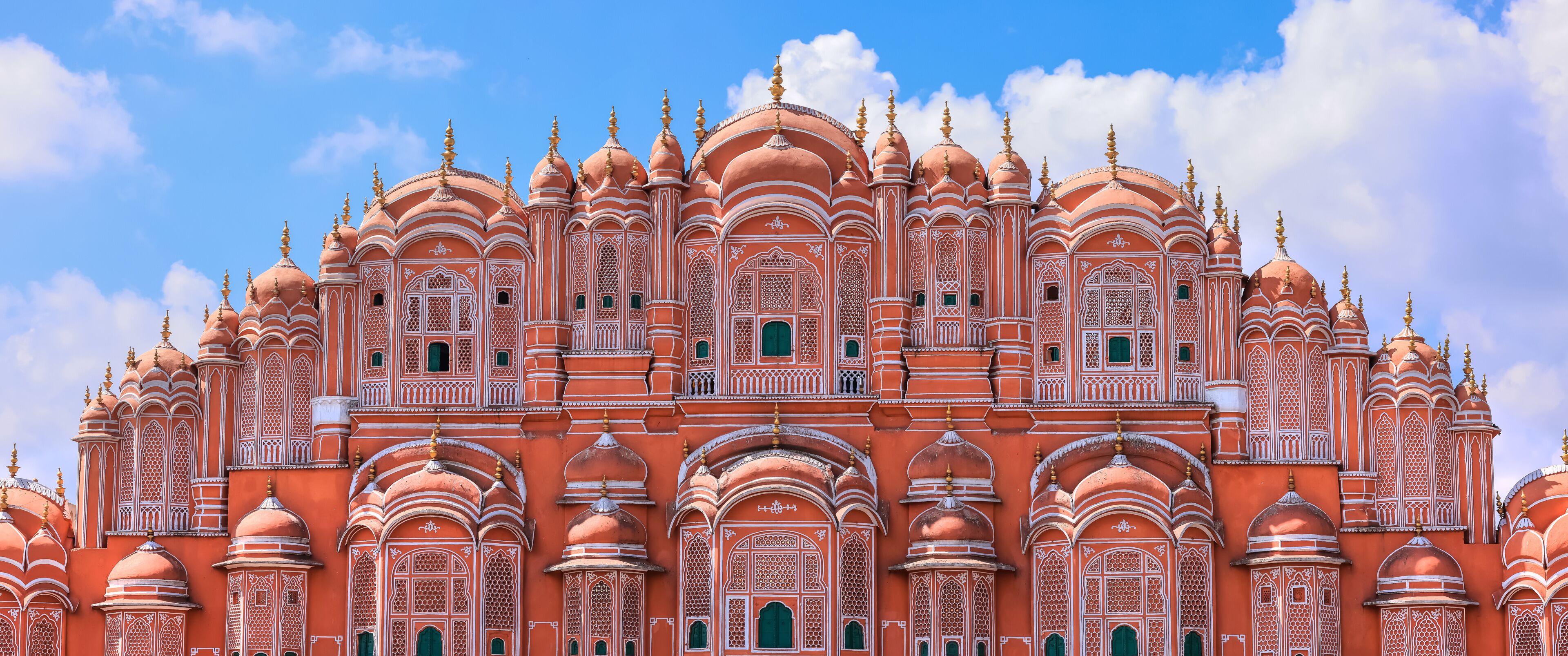 A large, ornate building with multiple domes and intricate architectural details.