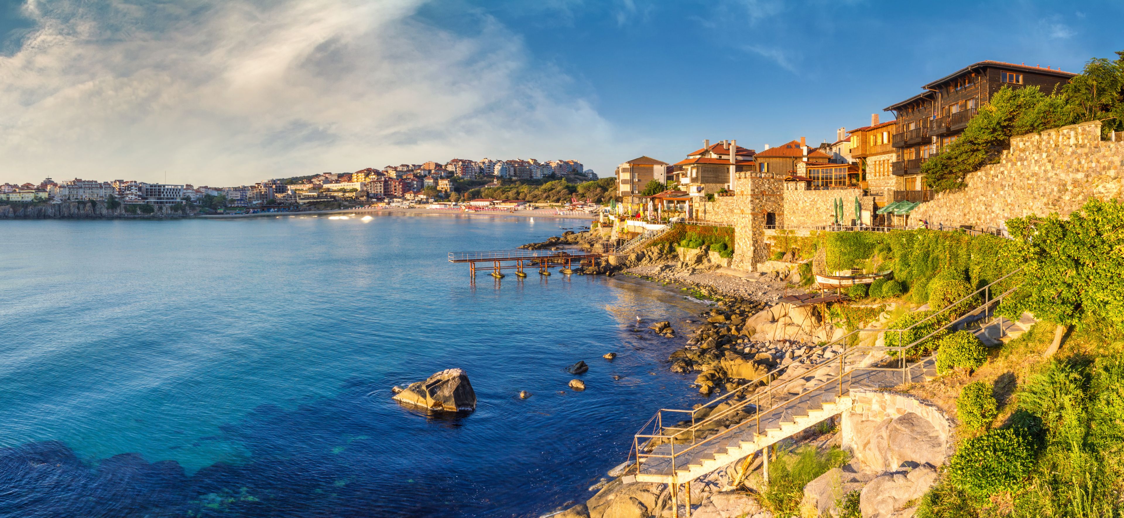 Coastal landscape banner, panorama - embankment with fortress wall in the city of Sozopol on the Black Sea coast in Bulgaria