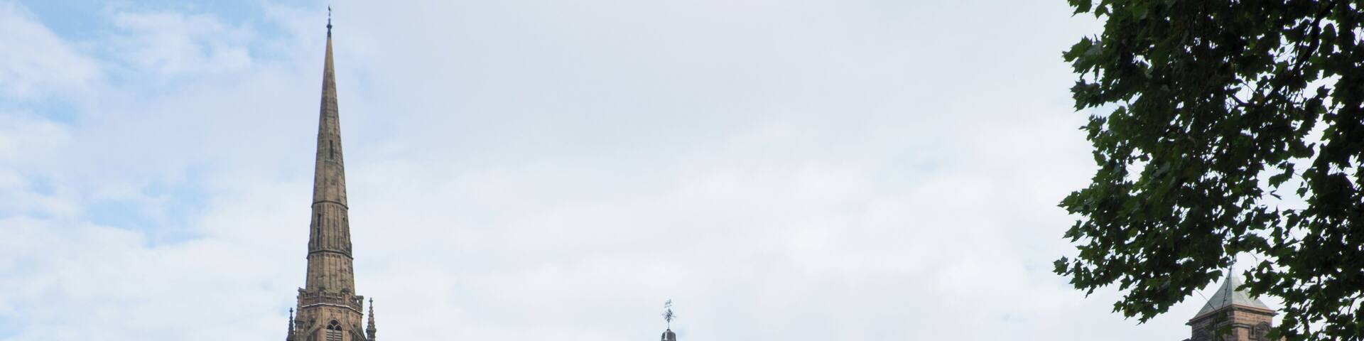 The Council House, Coventry with the 90-metre spire of the war-ruined 14th-century St Michael's Cathedral visible behind. This building, built 1913-17, is a Grade II Listed Building in England.