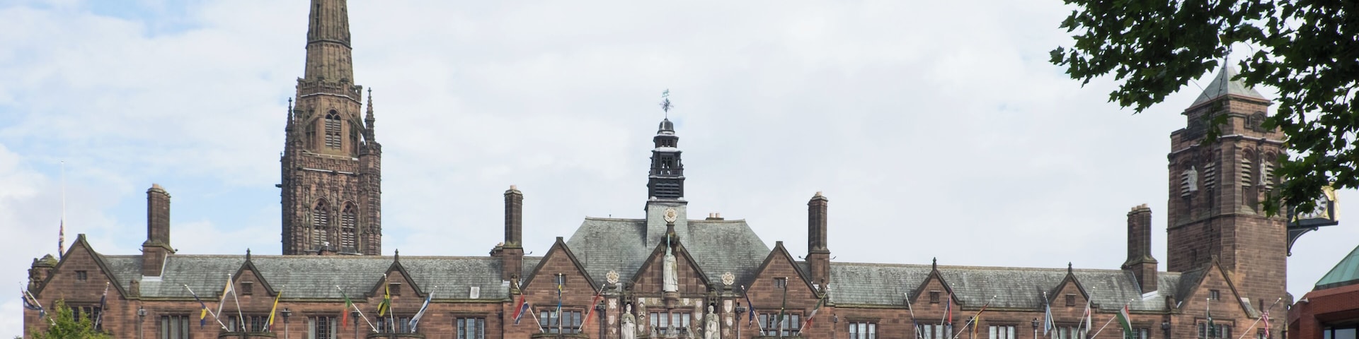 The Council House, Coventry with the 90-metre spire of the war-ruined 14th-century St Michael's Cathedral visible behind. This building, built 1913-17, is a Grade II Listed Building in England.