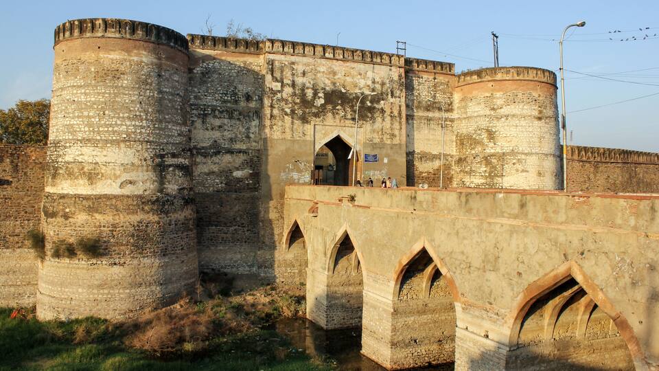 The ancient Lohagarh fort with the bridge across the river moat in the town of Bharatpur.