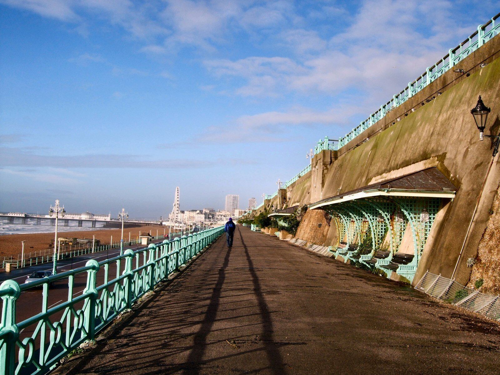 Max Miller Walk, Brighton. This path aka "The Shelf" provides a walkway between Madeira Drive and Marine Parade on Brighton Seafront. Brighton Wheel and Brighton Pier can be seen in the background