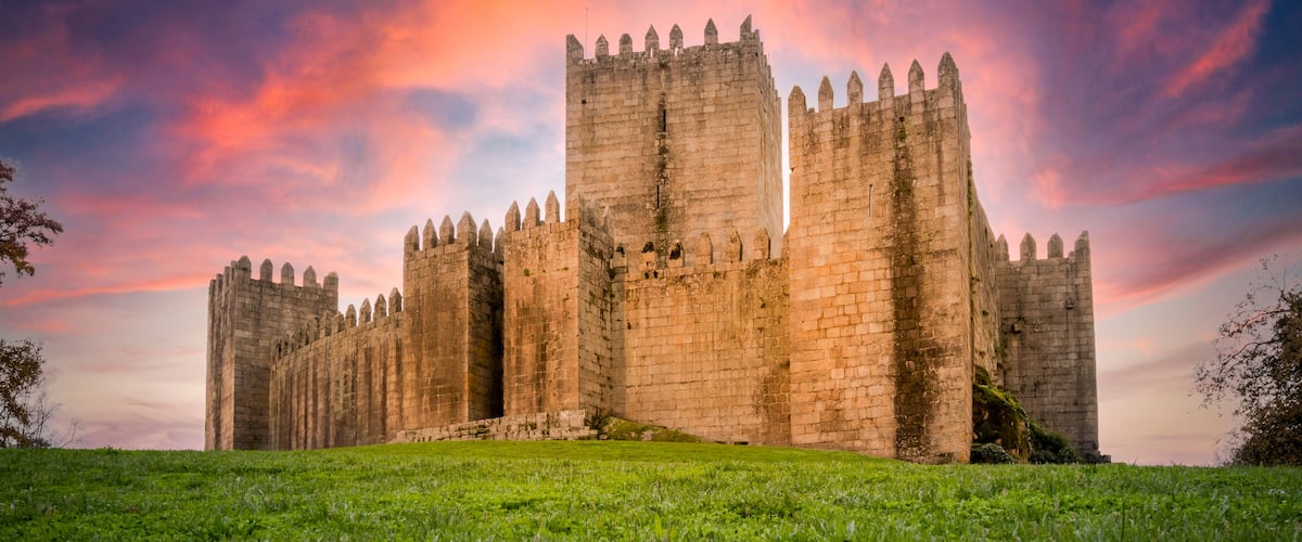 Low angle view of Guimarães castle at sunset - Portugal.
