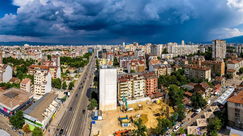 Amazing aerial panorama from a drone of city Sofia with stormy clouds, Bulgaria