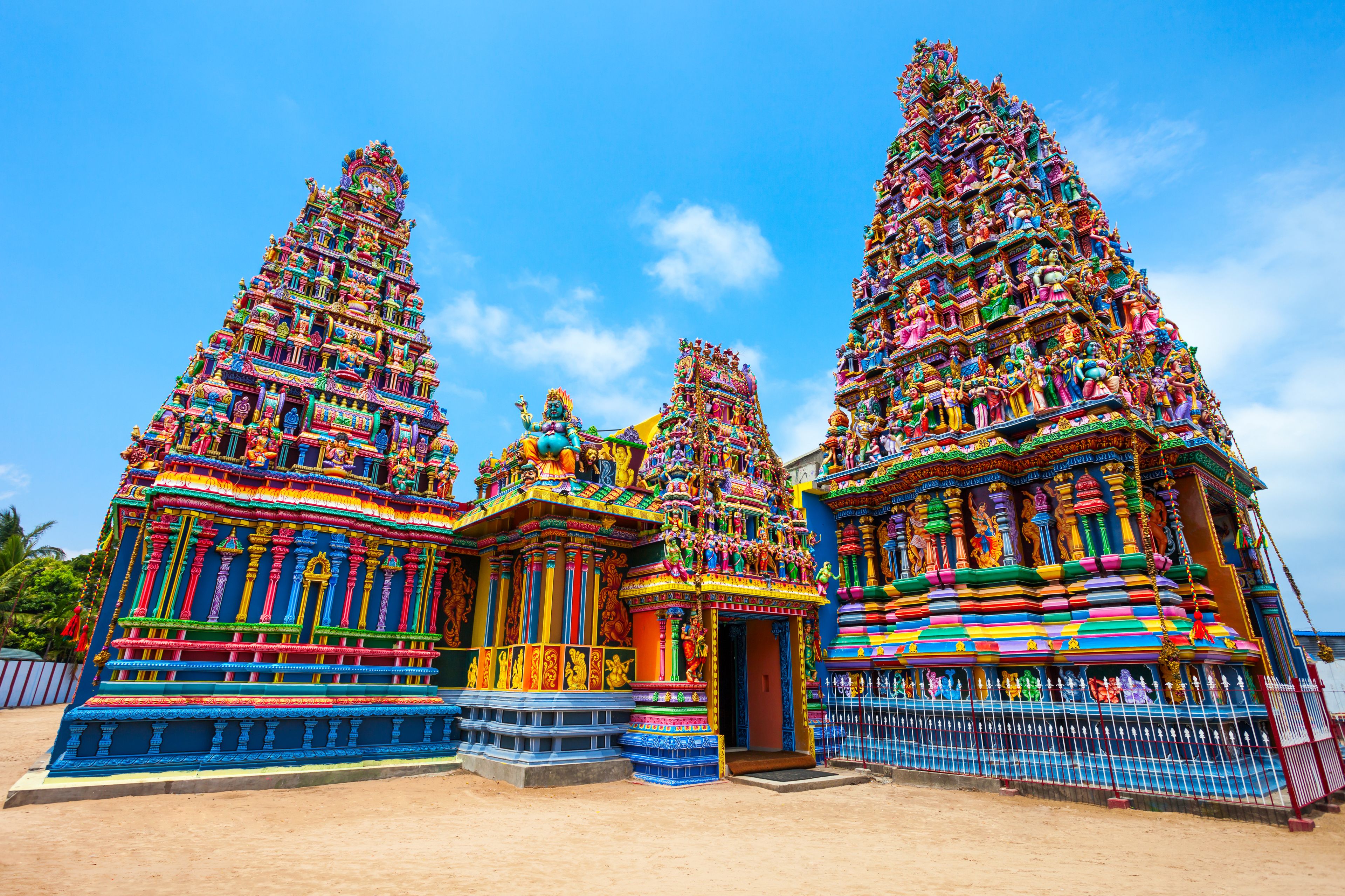 A colorful temple with intricate carvings and statues.